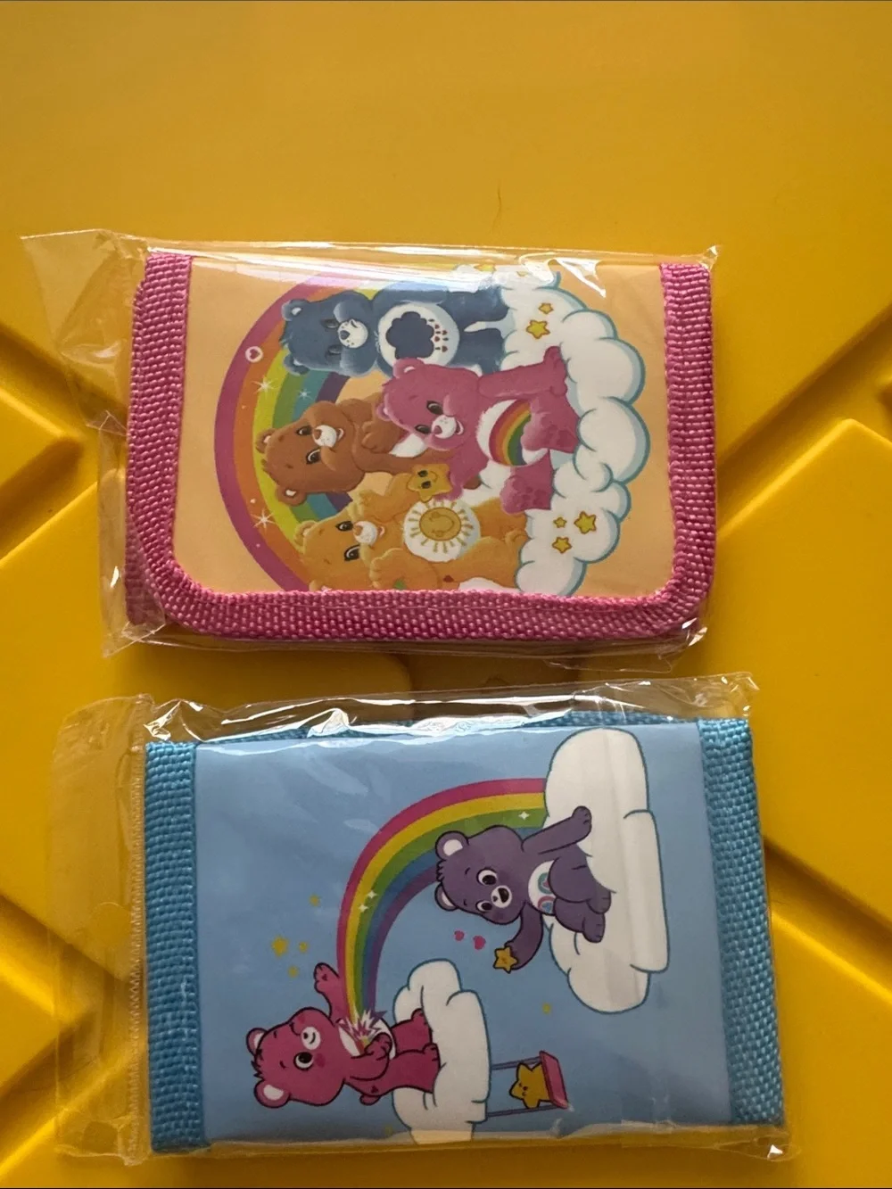 Care Bears Pink and Blue Zip Wallets with Rainbow Art